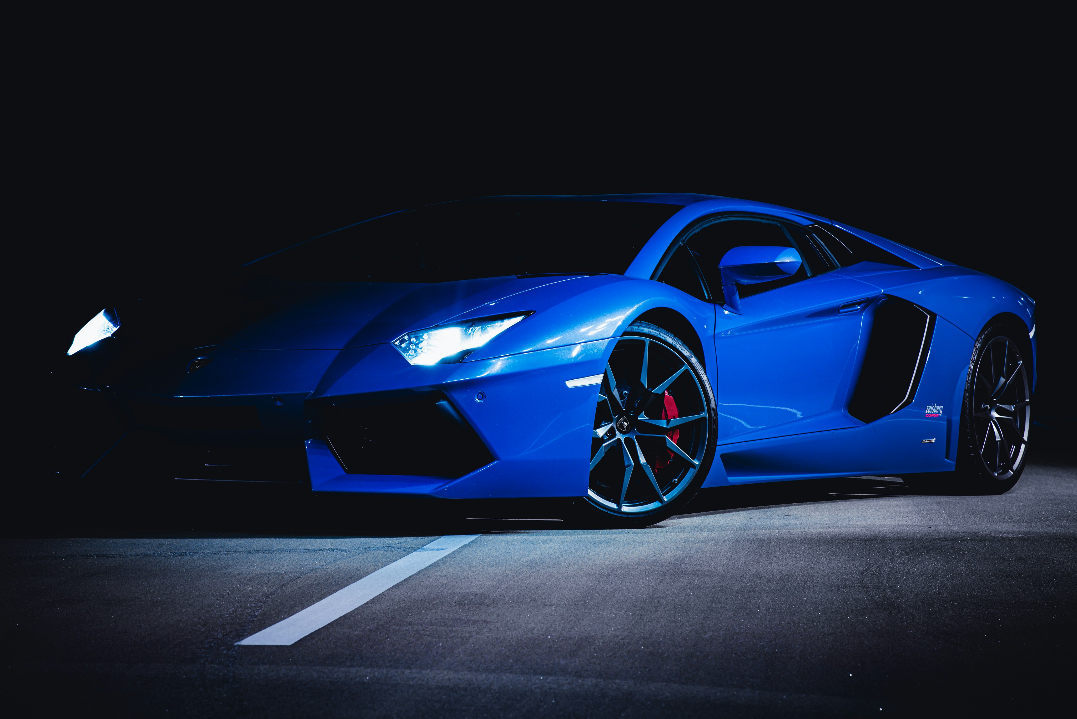 blue ferrari 458 italia on black background